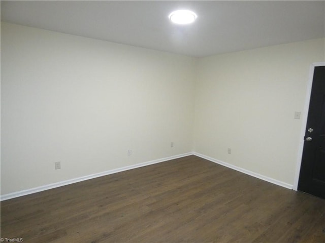 317 Westridge Dr, Yadkinville, NC 27055 - empty room with dark wood-style flooring and baseboards
