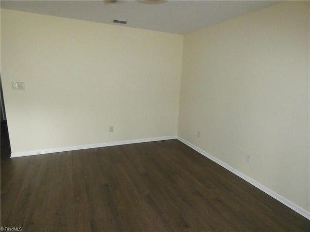 317 Westridge Dr, Yadkinville, NC 27055 - spare room featuring dark wood-style flooring and baseboards
