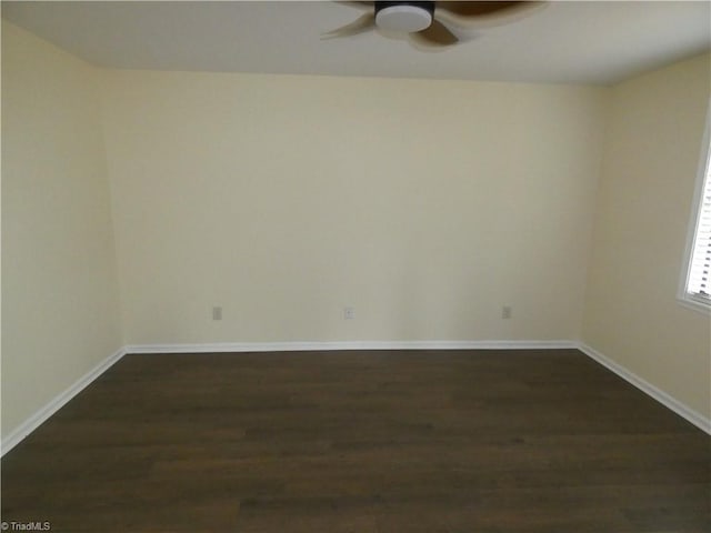 317 Westridge Dr, Yadkinville, NC 27055 - spare room with a ceiling fan, dark wood finished floors, and baseboards