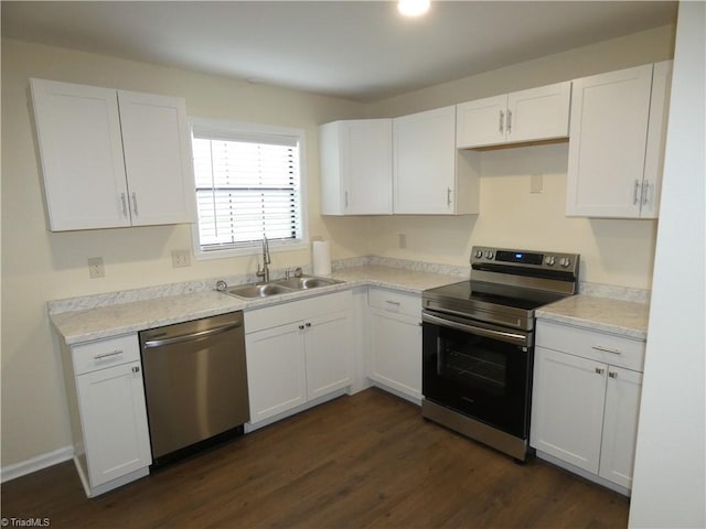 317 Westridge Dr, Yadkinville, NC 27055 - kitchen featuring stainless steel appliances, a sink, white cabinets, dark wood finished floors, and light countertops