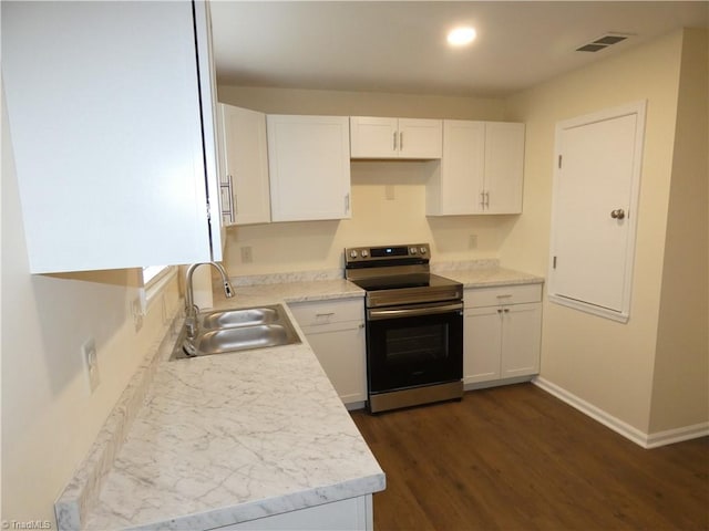 317 Westridge Dr, Yadkinville, NC 27055 - kitchen featuring electric stove, a sink, white cabinets, dark wood-style floors, and light countertops