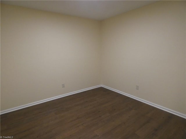 317 Westridge Dr, Yadkinville, NC 27055 - empty room featuring dark wood finished floors and baseboards