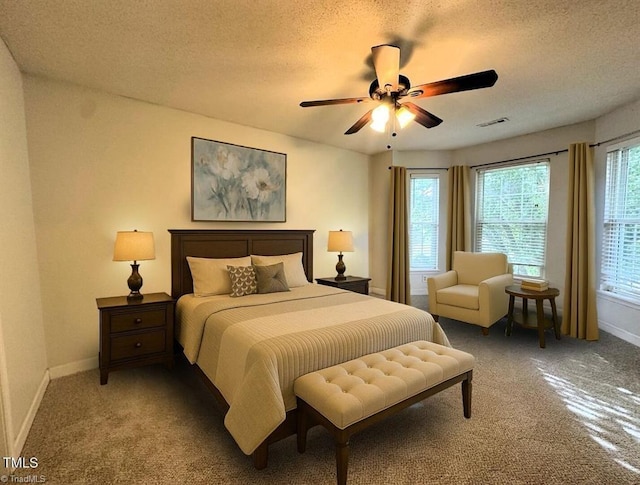 208 Mallard Creek Dr, Graham, NC 27253 - carpeted bedroom with a textured ceiling, visible vents, ceiling fan, and baseboards