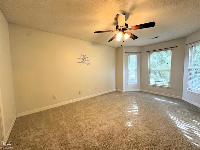 208 Mallard Creek Dr, Graham, NC 27253 - carpeted empty room featuring a textured ceiling, visible vents, ceiling fan, and baseboards
