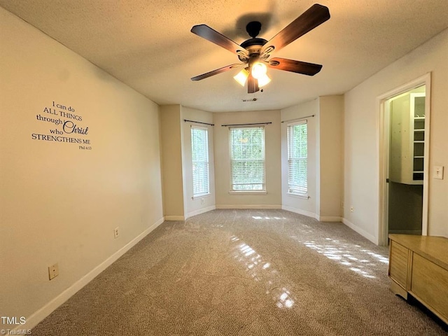 208 Mallard Creek Dr, Graham, NC 27253 - unfurnished room with baseboards, ceiling fan, a textured ceiling, and carpet flooring