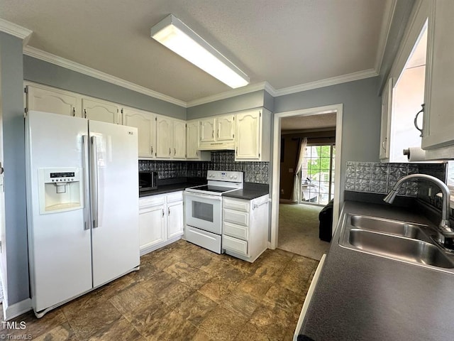 208 Mallard Creek Dr, Graham, NC 27253 - kitchen featuring crown molding, a sink, dark countertops, under cabinet range hood, and white appliances