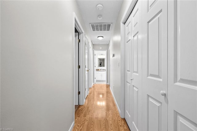 hallway featuring light wood-type flooring