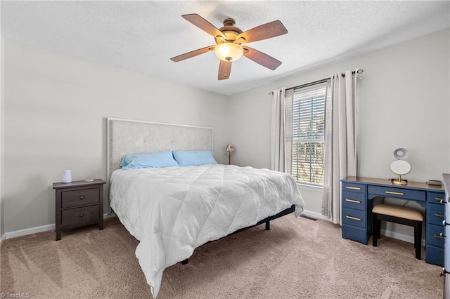 bedroom featuring light colored carpet and ceiling fan