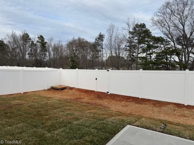 view of yard featuring a fenced backyard