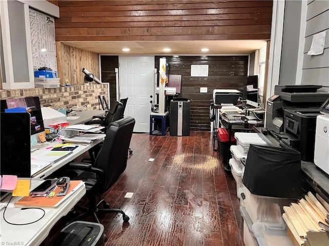 home office featuring wood walls and dark wood-type flooring