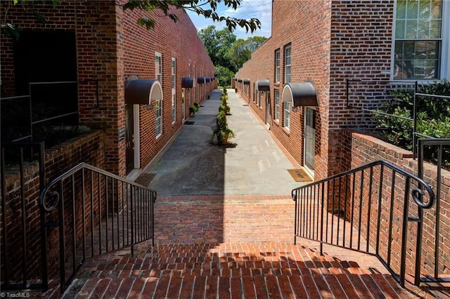 view of property exterior featuring brick siding