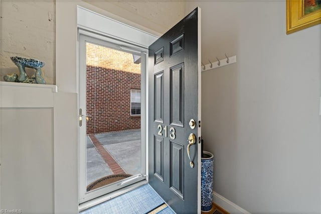 interior space featuring brick wall