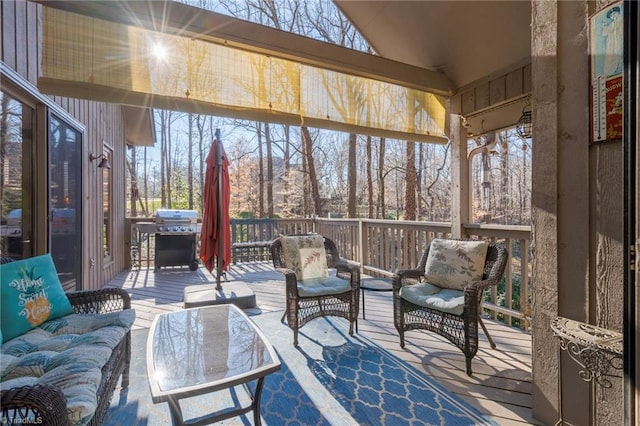 sunroom / solarium featuring vaulted ceiling