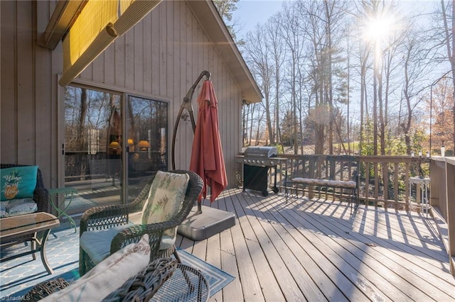 wooden deck featuring area for grilling