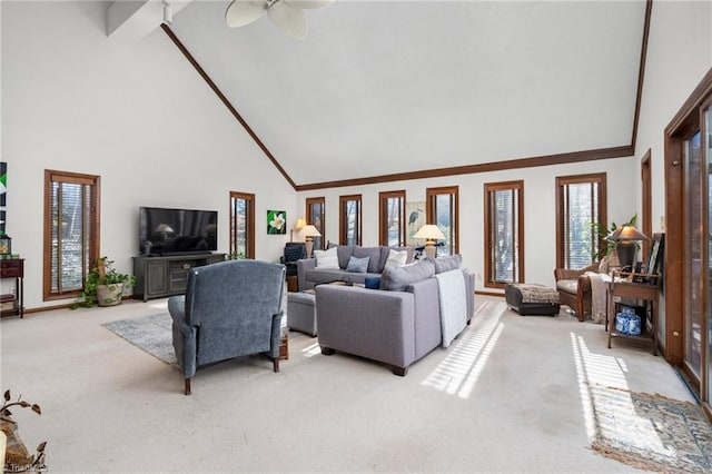 living area featuring light colored carpet, ceiling fan, and high vaulted ceiling