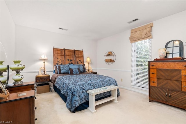 bedroom featuring visible vents and carpet flooring