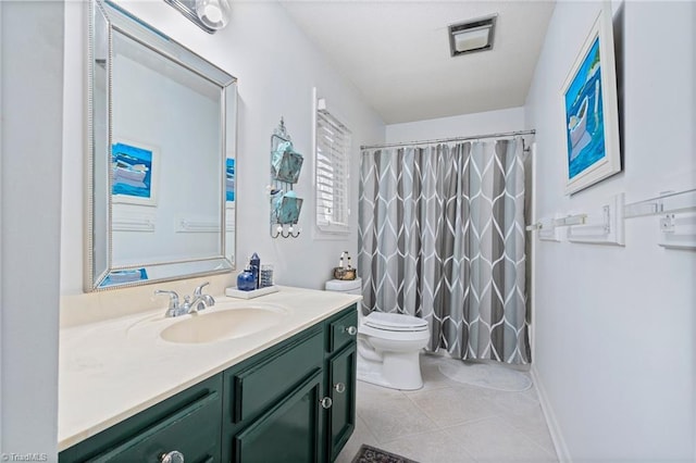 bathroom featuring a shower with curtain, toilet, vanity, and tile patterned flooring