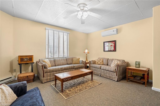 carpeted living room with a wall mounted AC, baseboards, ceiling fan, baseboard heating, and a paneled ceiling