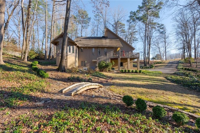 view of property exterior featuring a wooden deck