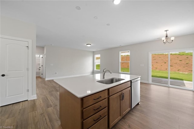 5751 Siler St, Trinity, NC 27370 - kitchen featuring a sink, dishwasher, light countertops, open floor plan, and wood finished floors