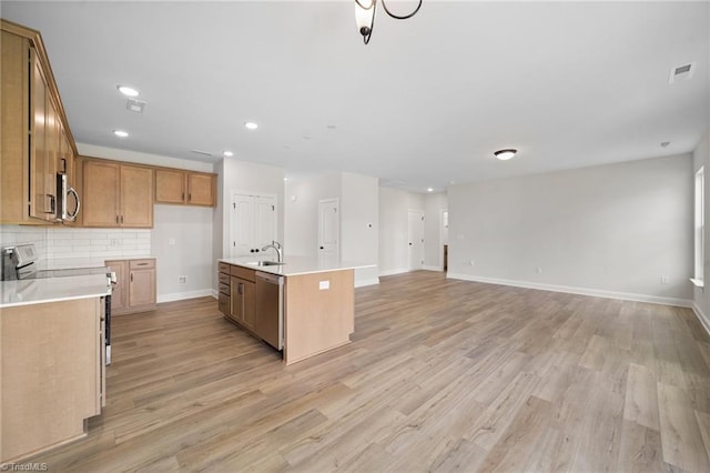 5751 Siler St, Trinity, NC 27370 - kitchen featuring a sink, light wood-type flooring, stainless steel appliances, and brown cabinets