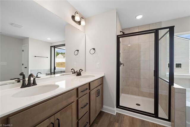 5751 Siler St, Trinity, NC 27370 - bathroom featuring double vanity, a sink, wood finished floors, and a shower stall