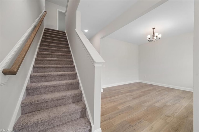 5751 Siler St, Trinity, NC 27370 - stairs featuring an inviting chandelier, baseboards, recessed lighting, and wood finished floors