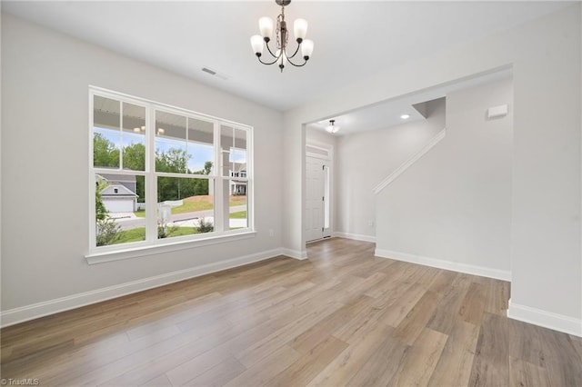 5751 Siler St, Trinity, NC 27370 - interior space featuring an inviting chandelier, baseboards, wood finished floors, and visible vents