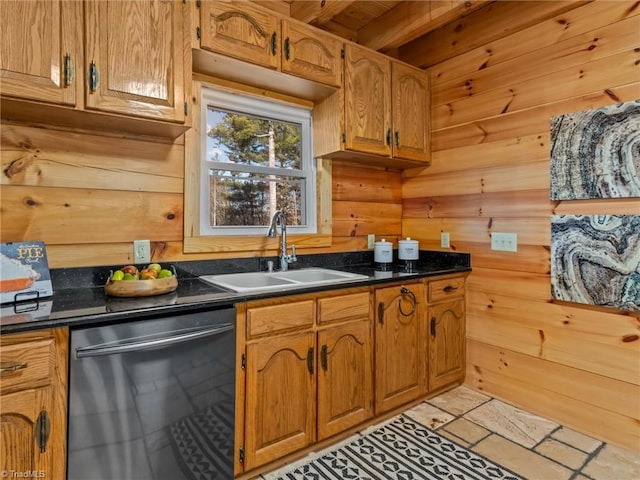 kitchen featuring stainless steel dishwasher, beam ceiling, sink, and wooden walls