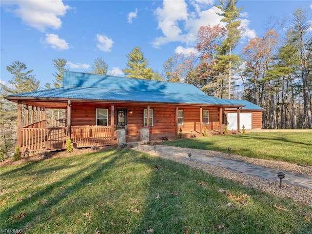 log cabin with covered porch and a front lawn