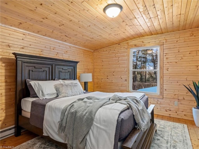 bedroom featuring wood walls, hardwood / wood-style floors, wooden ceiling, and lofted ceiling