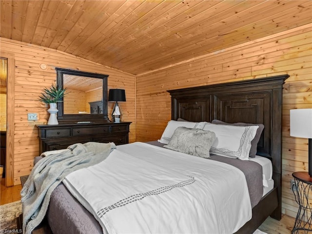 bedroom with wood walls, light hardwood / wood-style floors, wooden ceiling, and vaulted ceiling