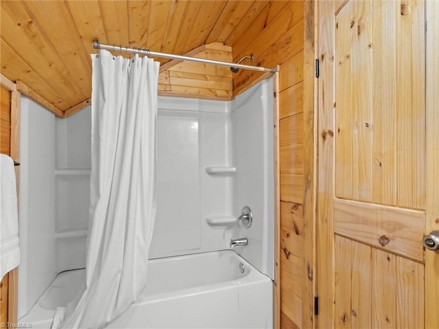 bathroom with shower / tub combo, lofted ceiling, wooden ceiling, and wood walls