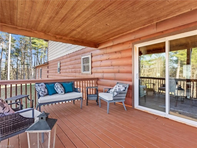 wooden deck featuring an outdoor living space