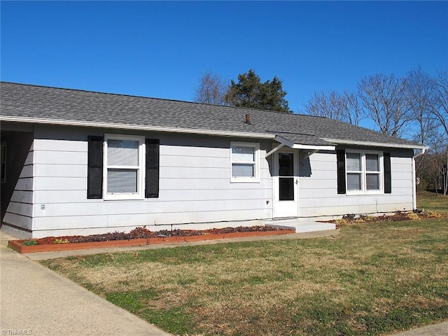 ranch-style house with a front yard