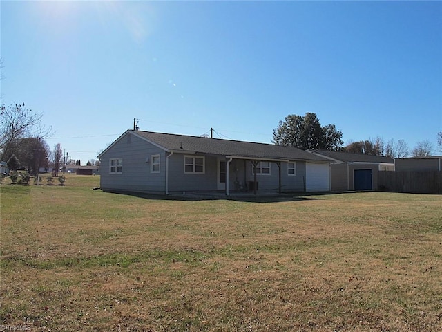 back of property with a lawn