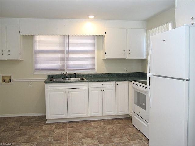 kitchen featuring white cabinets, white appliances, and sink