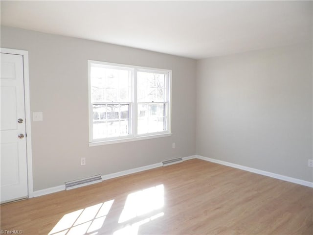 empty room featuring light hardwood / wood-style floors