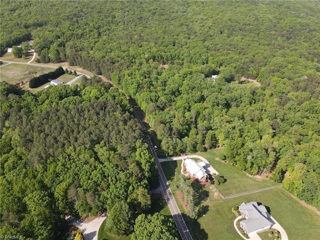 bird's eye view featuring a view of trees