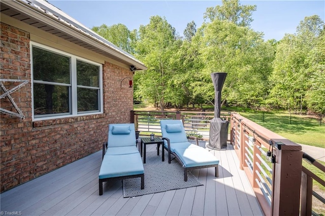 wooden deck with a yard