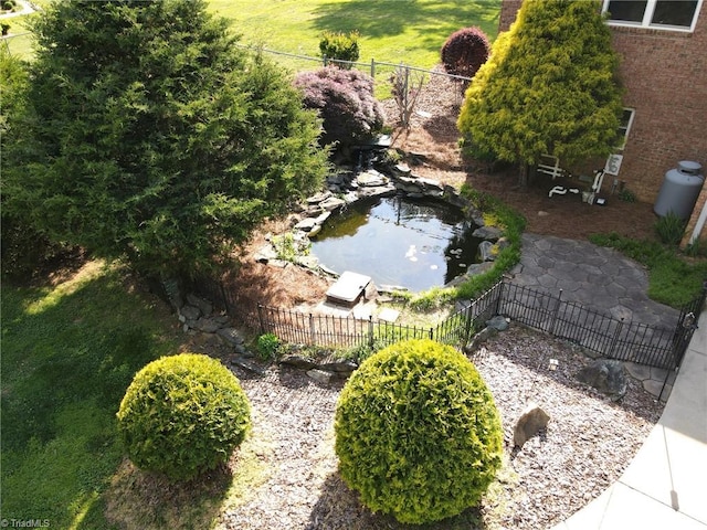 drone / aerial view with a small pond