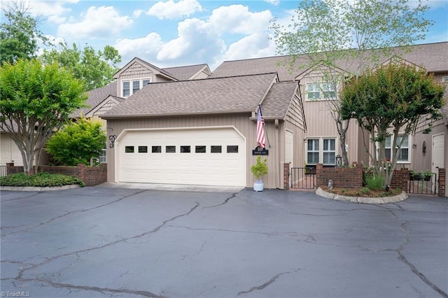 149 Warwicke Pl, Bermuda Run, NC 27006 - view of front of home featuring driveway, roof with shingles, a garage, and a gate