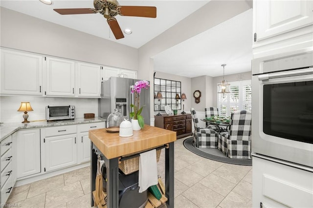 149 Warwicke Pl, Bermuda Run, NC 27006 - kitchen with oven, a ceiling fan, white cabinetry, stainless steel refrigerator with ice dispenser, and recessed lighting