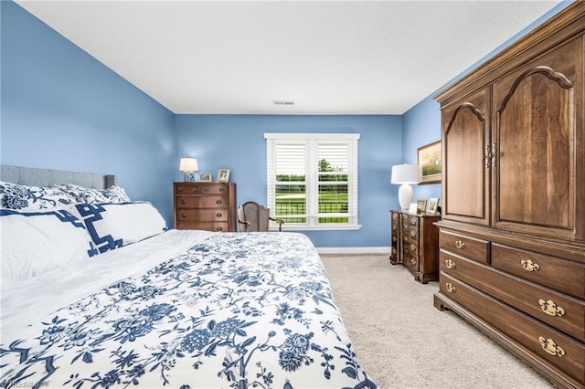 149 Warwicke Pl, Bermuda Run, NC 27006 - bedroom featuring light colored carpet and baseboards