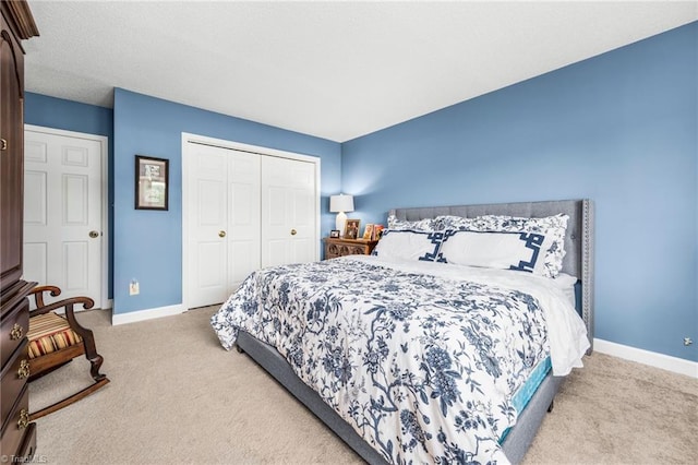 149 Warwicke Pl, Bermuda Run, NC 27006 - bedroom with carpet, baseboards, and a closet