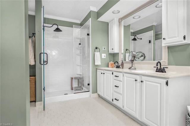 149 Warwicke Pl, Bermuda Run, NC 27006 - full bathroom with ornamental molding, a shower stall, double vanity, tile patterned floors, and baseboards