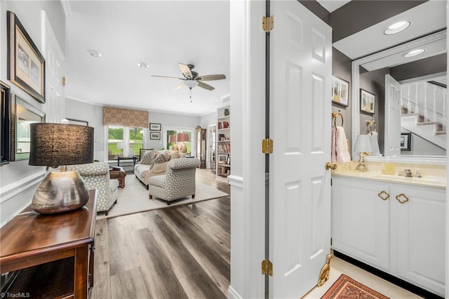 149 Warwicke Pl, Bermuda Run, NC 27006 - living area with ceiling fan, crown molding, stairway, light wood-style floors, and recessed lighting