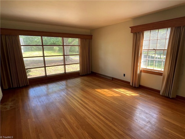 1706 Windsor Dr, High Point, NC 27262 - unfurnished room with plenty of natural light, wood finished floors, and baseboards