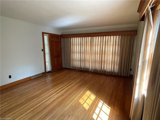 1706 Windsor Dr, High Point, NC 27262 - empty room featuring light wood-style floors, healthy amount of natural light, and baseboards