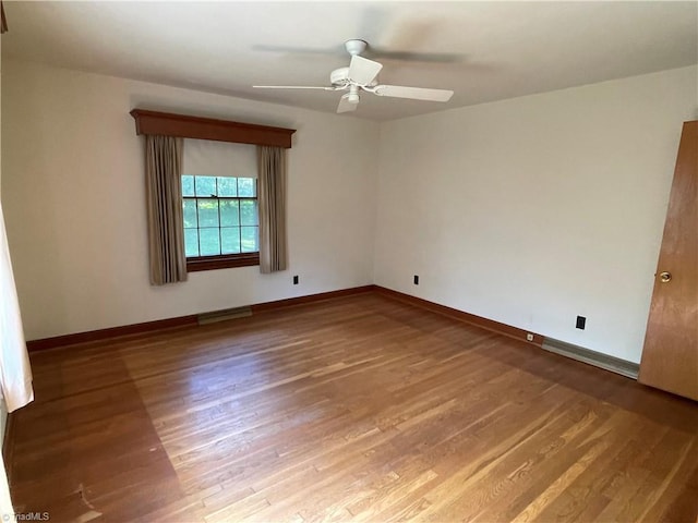 1706 Windsor Dr, High Point, NC 27262 - spare room with wood finished floors, baseboards, and a ceiling fan